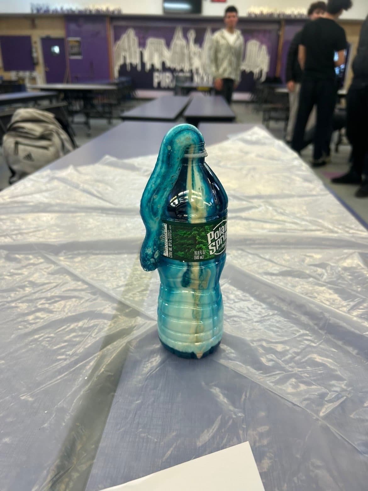 Chemistry club students running a bottle experiment demo